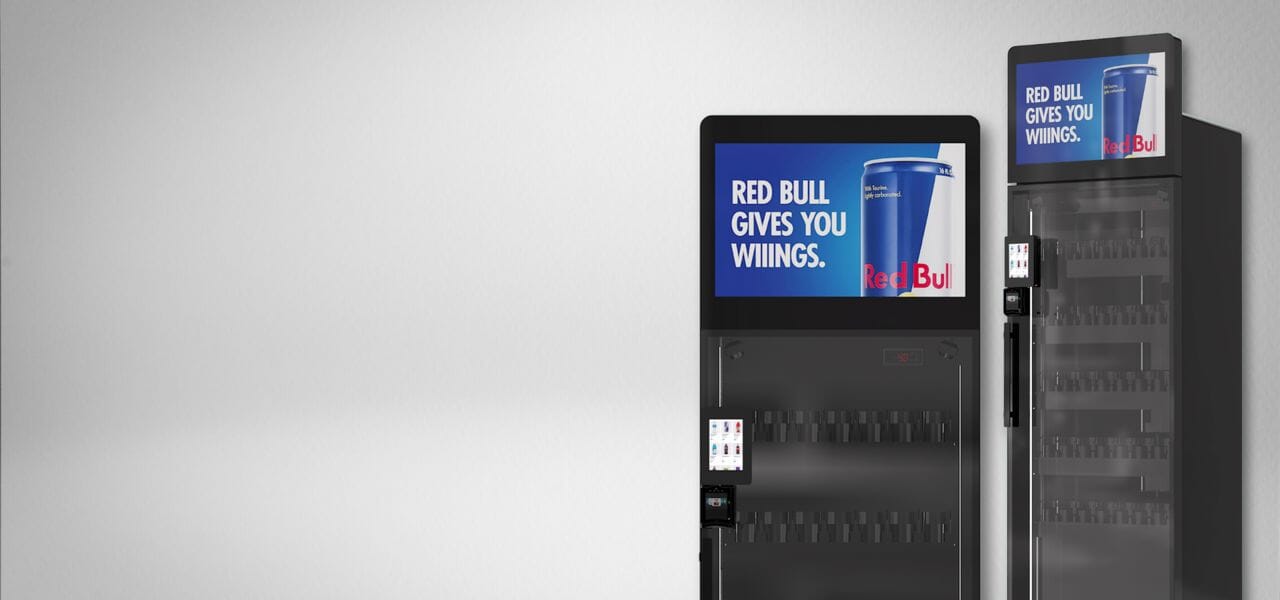 Two AI Smart Vending Machines displaying Red Bull.